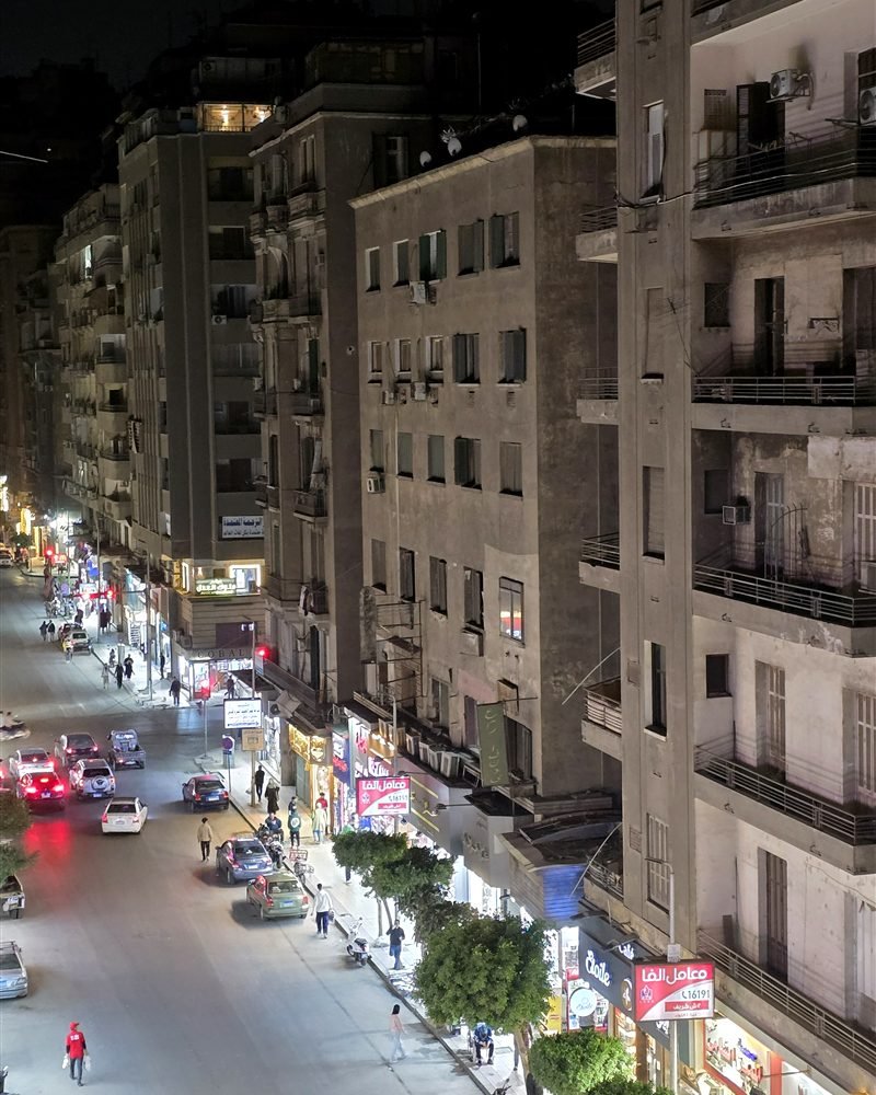 Talaat Harb Street in Downtown Cairo at night, seen from a high balcony